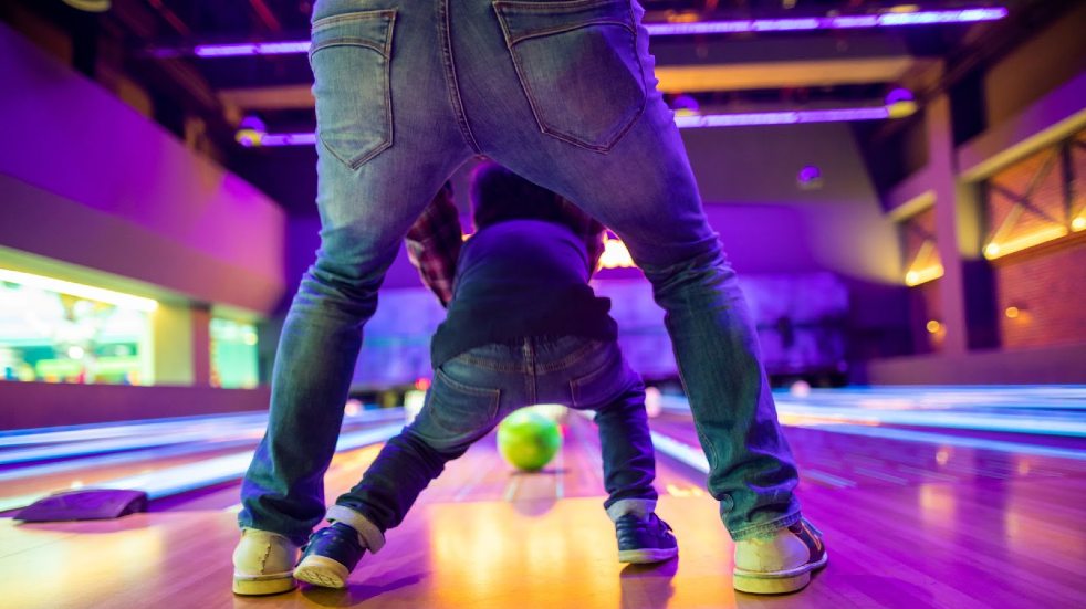 family at bowling alley